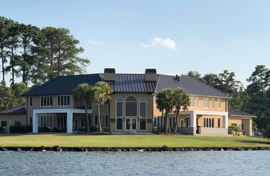 Freshly painted waterfront home exterior by Stewart Paint Service